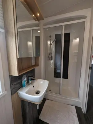 a bathroom with a sink and a shower at Swift Bordeaux Sea View No 2 in Dunoon