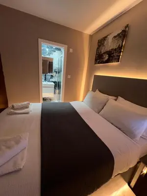 a bedroom with a large bed and a window at Rest Inn Edmonton in Moffat