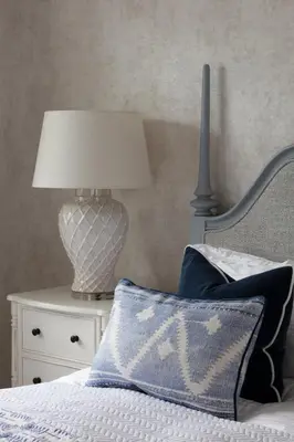 a bedroom with a bed with a lamp and a pillow at Stylish Retreat Auchterarder in Auchterarder