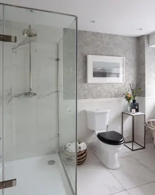 a bathroom with a toilet and a glass shower at Stylish Retreat Auchterarder in Auchterarder