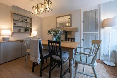 a kitchen and dining room with a table and chairs at Tegfryn in Moffat