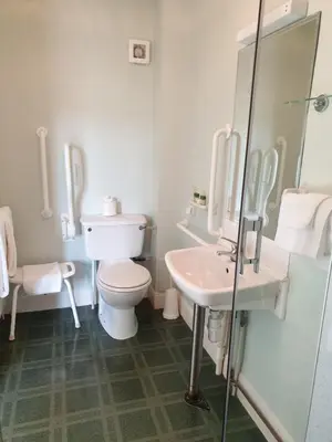 a bathroom with a toilet and a sink at Corsewall Lighthouse Hotel in Kirkcolm
