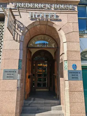 an entrance to a hotel with the door open at Frederick House Hotel in Edinburgh