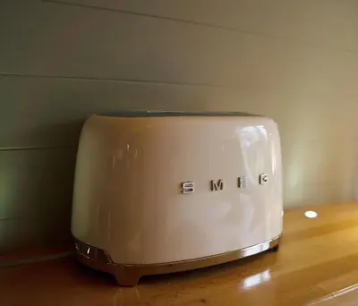 a toaster sitting on top of a wooden table at RiverBeds - Luxury Wee Lodges with Hot Tubs in Glencoe