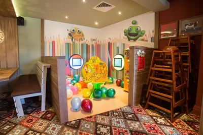 a room with a play room with a set of mirrors at Red Squirrel, Stevenston by Marston's Inns in Stevenston