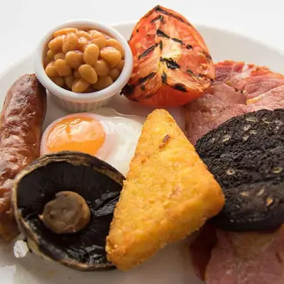 a plate of food with eggs mushrooms and other foods at Red Squirrel, Stevenston by Marston's Inns in Stevenston