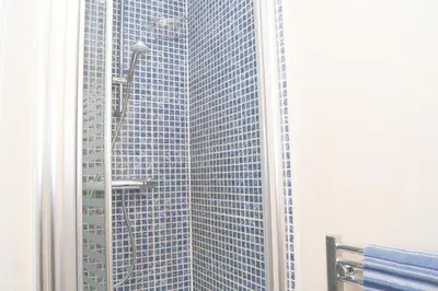 a view of a skyscraper through a window at Wood Court, Troon in Troon