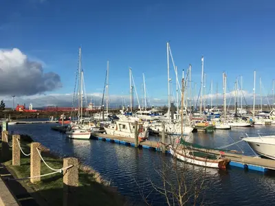 a bunch of boats are docked in a marina at Wood Court, Troon in Troon