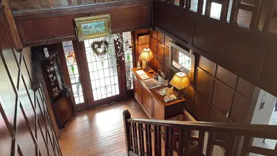 an overhead view of a hallway in a home with a staircase at Fox House Thirdpart Farm in Beith
