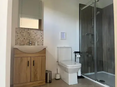 a bathroom with a toilet and a sink and a shower at Ceo Mara Croft b&b & 2 luxury Cabins in Taynuilt