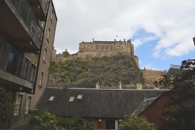 a castle on top of a hill with buildings at Castle view&Grassmarket studio flat with Luxury bathroom in Edinburgh