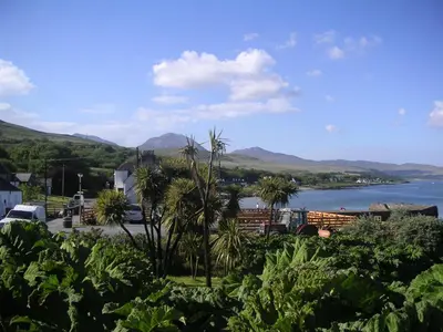 a view of a body of water with mountains at Braeside Craighouse Jura in Craighouse