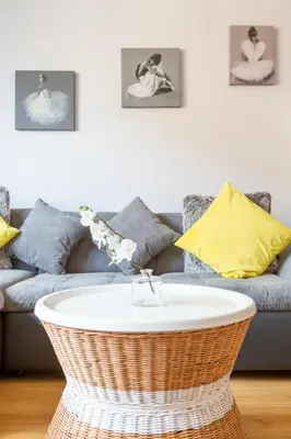 a living room with a couch and a table at Cosy Apartment in Quiet City-Centre with Car Park in Glasgow