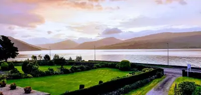 a view of a lake with mountains in the background at Rudha-na-Craige in Inveraray