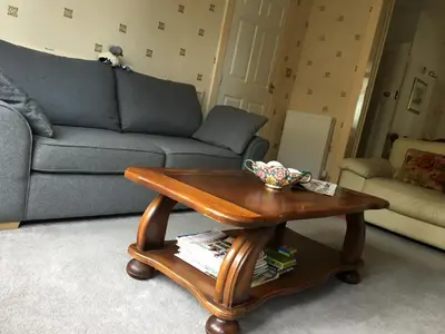 a living room with a coffee table and a couch at Charles's Street in Largs