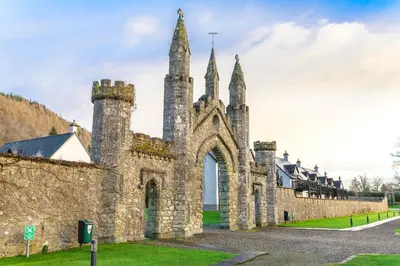an old stone building with towers on the side of it at The Kenmore Club in Kenmore