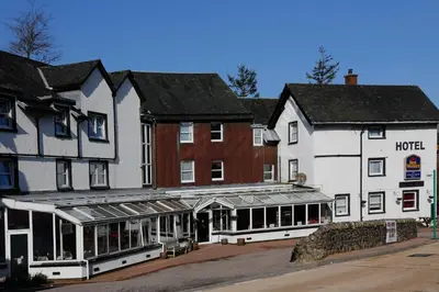 a row of buildings with a hotel on a street at BEST WESTERN The Crianlarich Hotel in Crianlarich