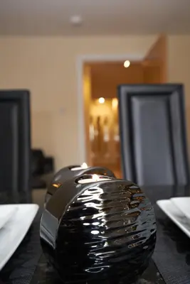 a black comb sitting on top of a table at Edinburgh Pearl Apartments - Haymarket Residence in Edinburgh