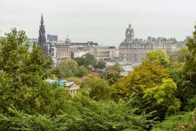 a view of a city with trees and buildings at Ramsay Gardens - Grand 4-Bedroom Apartment Next To Castle in Edinburgh