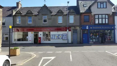 an empty street in a town with buildings at Blair Drummond Holiday Home in Doune