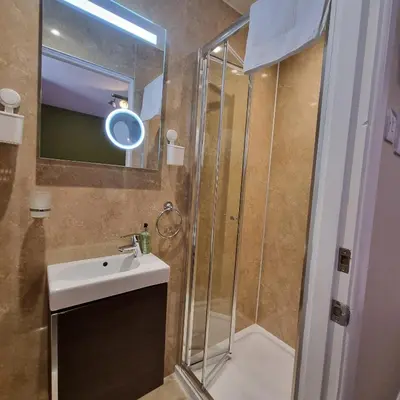 a bathroom with a sink and a shower at Rose Villa in Oban