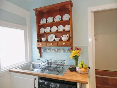 a kitchen with a sink and a counter with plates at Gracedieu in Killin