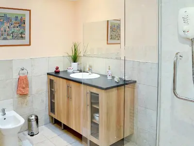 a bathroom with a sink and a shower at Eilean Donan in Kirknewton