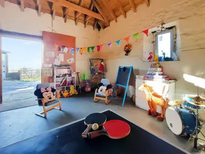 a room with a drum set and toys in it at Old Barn Farm Cottage - Cc in Uplawmoor
