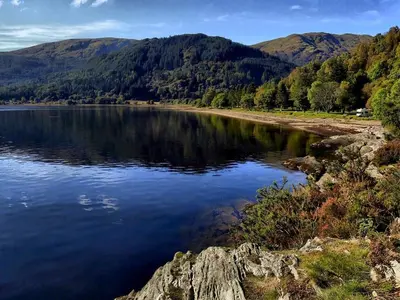 a body of water with mountains in the background at Fern Cottage in Ardentinny
