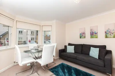 a living room with a couch and a table at Dunfermline - Premium Two Bedroom Apartment - KW in Dunfermline