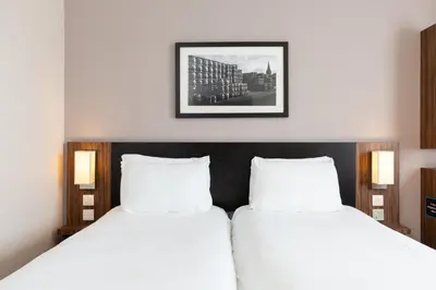 two beds sitting next to each other in a bedroom at Sweet Chestnut, Dunfermline by Marston's Inns in Dunfermline