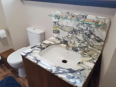 a bathroom with a sink and a toilet at Bonkle House in Wishaw