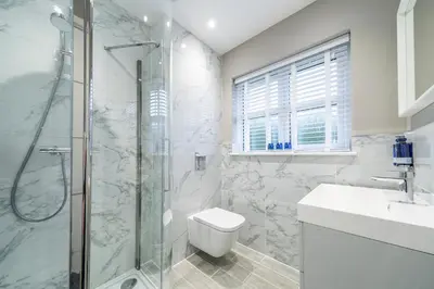 a bathroom with a shower and a toilet and a sink at The Pines - Luxury 3-Bed Apartment Near Golf & Spa, Gleneagles, Auchterarder in Auchterarder