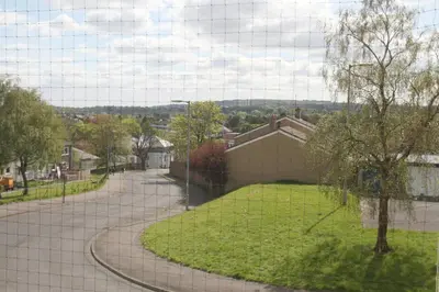 a view from a window of a house with a park at Southside Apartment Glasgow in Glasgow