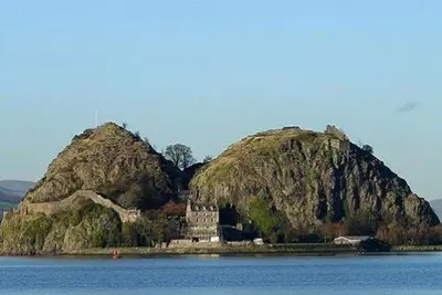an island in the middle of a body of water at Whiteley's Cottages in Dumbarton