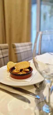 a plate of food sitting on a table at Loch Long Hotel in Arrochar