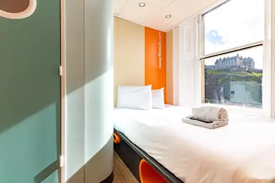 a small room with a bed and a window at easyHotel Edinburgh in Edinburgh