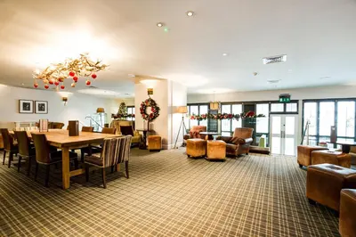 a dining room with a table and chairs at Barony Castle Hotel in Peebles