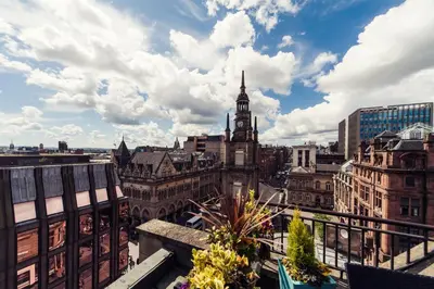 a view of a city skyline with a clock tower at Carlton George Hotel in Glasgow