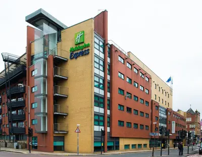 a building with a sign on the side of it at Holiday Inn Express - Glasgow - City Ctr Riverside by IHG in Glasgow