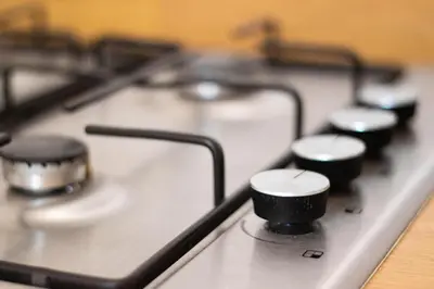 a close up of a gas stove top withobsessions at Glasgow City Flats - Merchant City in Glasgow