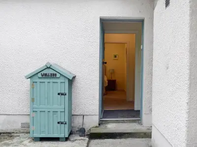 a door leading to a hallway with a door that says witch at Fernwoodlea in Blairhall