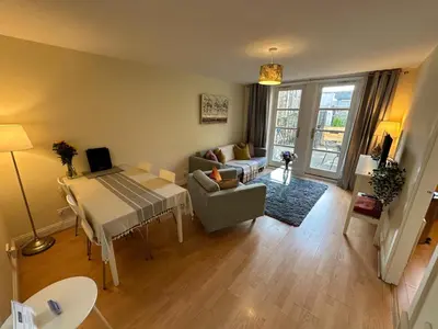 a living room with a couch and a table at Castle Wynd Old Town in Edinburgh