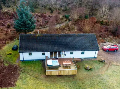 an aerial view of a small house with a car at Glenachulish Bay with Hot Tub in Glencoe