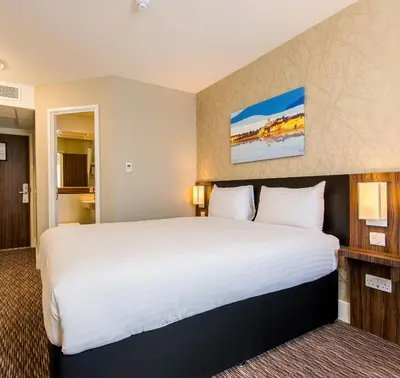 a bedroom with a large bed in a hotel room at Chain Runner, Livingston by Marston's Inns in Livingston