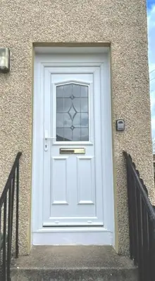 a white door with a window on a building at Kelpies Serviced Apartments - Wallace in Falkirk