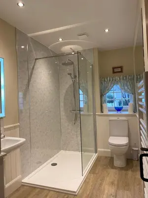 a bathroom with a shower and a toilet at Spacious cottage - walk to Crieff in Crieff