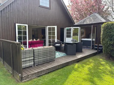a wooden deck with a gazebo at La Fortuna Lodges in Stirling