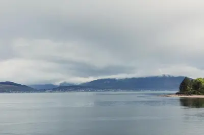 a large body of water with mountains in the background at The Inverkip Restaurant, Bar & Hotel in Inverkip