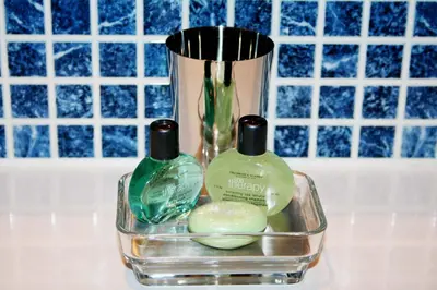 two bottles of soap and a vase on a counter at Dreamhouse Apartments Glasgow West End in Glasgow